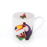 A bone china mug with a colorful illustration of a happy toucan holding a bowl.